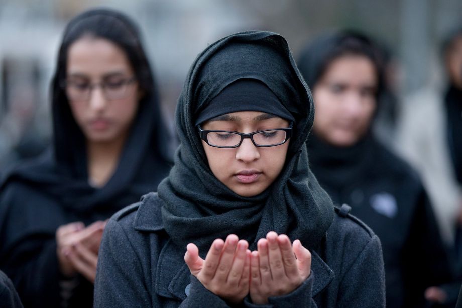 Shiite muslims pray together while they rally for peace outside of the White House Sunday Dec. 6 2015 in Washington. President Barack Obama will address the nation from the Oval Office on Sunday night about the steps the government is taking to fulfil