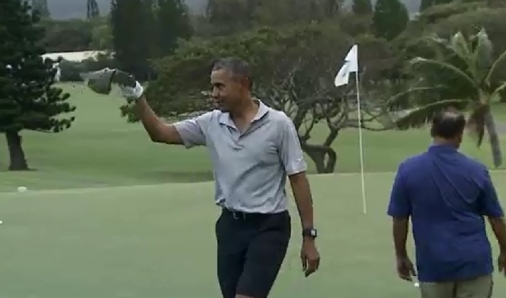 The Latest: Obama starts Hawaii vacation on the green