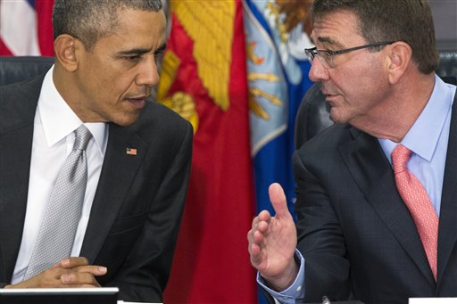 President Barack Obama talks with Defense Secretary Ash Carter during a meeting with the National Security Council about the fight against the Islamic State group Monday Dec. 14 2015 at the Pentagon