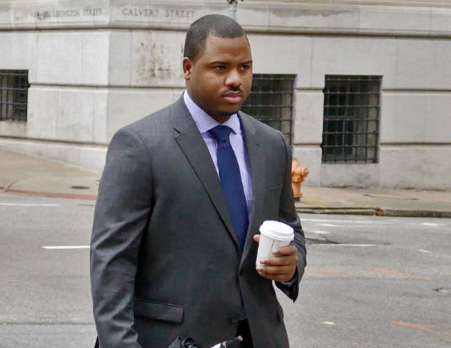 Baltimore City police officer William Porter one of six Baltimore police officers charged with the death of Freddie Gray walks to the courthouse