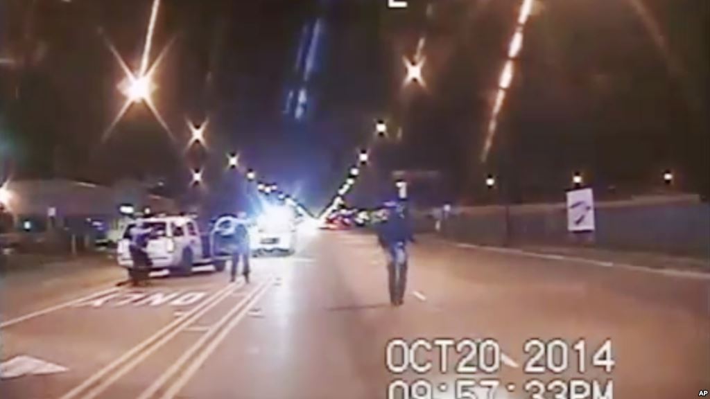 A frame grab from dash-cam video provided by the Chicago Police Department shows Laquan Mc Donald walks down the street moments before being shot by officer Jason Van Dyke on Oct. 20 2015