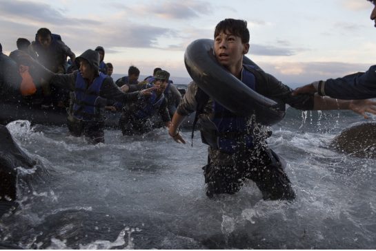 After battling rough seas and high winds on the crossing from Turkey migrants arrive on the northern shore of Lesbos Island in Greece on Oct. More than one million have crossed into Europe by sea in 2015