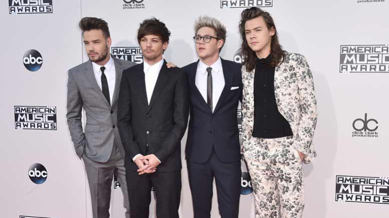 Harry Styles steals the show at American Music Awards in INCREDIBLE floral suit