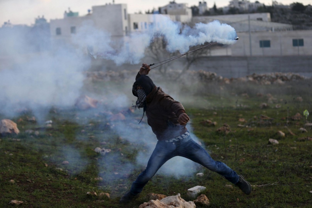 Two Palestinians shot dead after stabbing Israeli soldier army