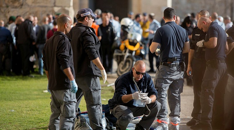 Israeli security personnel at the scene where two Palestinian stabbed three Israelis at the Old City’s Jaffa Gate in Jerusalem