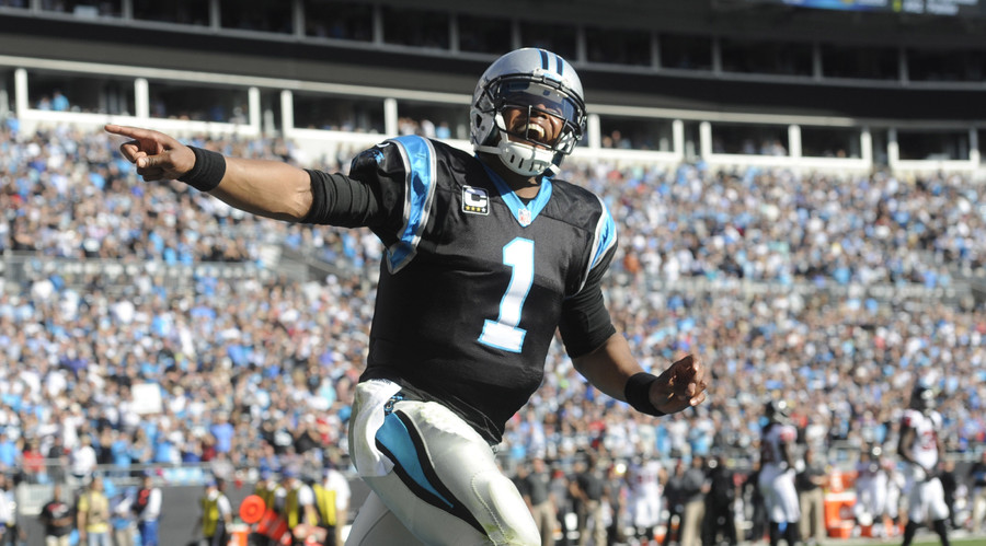 Carolina Panthers quarterback Cam Newton celebrates after his team scores a touchdown during the game against the Atlanta Falcons