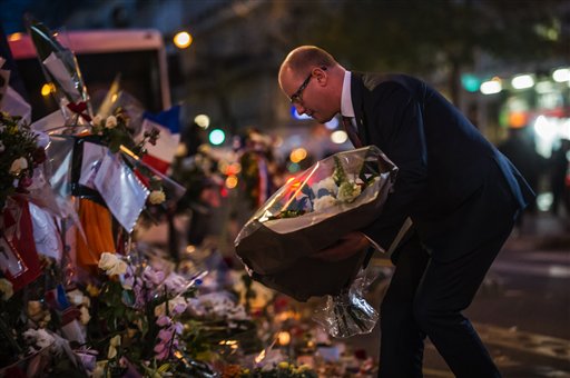 Czech Republic Prime Minister Bohuslav Sobotka pays his respects to victims of the Paris attacks in front of the Bataclan concert hall in Paris Monday Nov. 30 2015. The country remains on high alert for possible terrorist attacks after Islamic extremi