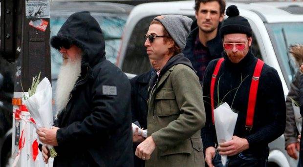 Dave Catching, Julian Dorio and Jesse Hughes, members of Eagles of Death Metal band arrive at the Bataclan concert hall to pay tribute to the shooting victims in Paris France