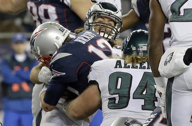 New England Patriots quarterback Tom Brady scores a touchdown on a quarterback sneak against the Philadelphia Eagles during the second half of an NFL football game Sunday Dec. 6 2015 in Foxborough Mass