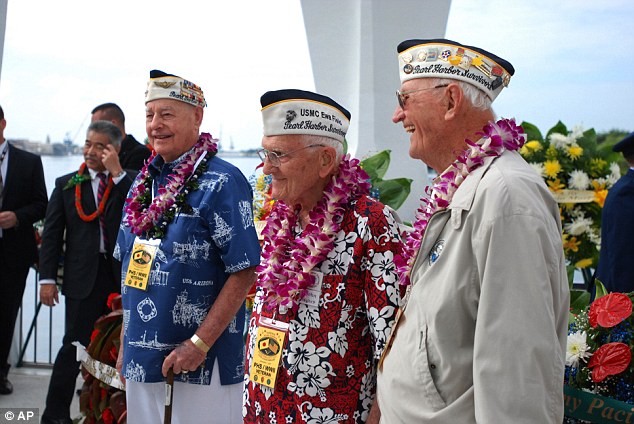 Pearl Harbor survivors Lou Cantor John Hughes and Ed Schuler gathered in Hawaii for a wreath laying ceremony to mark the 74th anniversary of the Japanese attack which killed 2,400 Americans