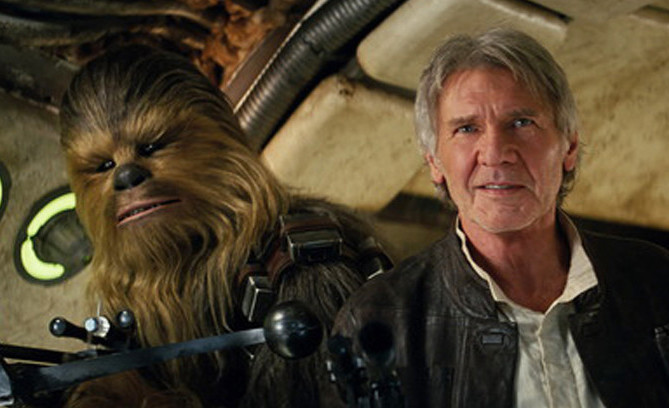 Peter Mayhew plays Chewbacca and Harrison Ford is Han Solo in “Star Wars The Force Awakens.”