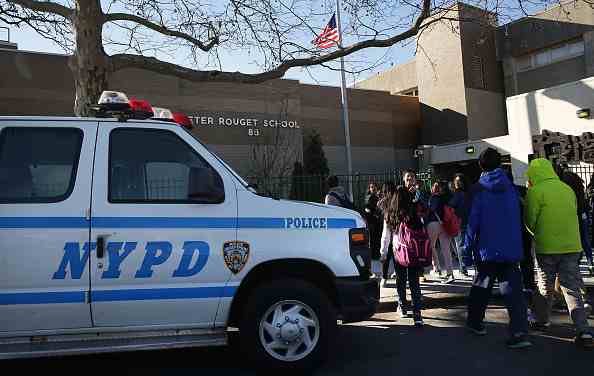 Why did Los Angeles and New York City school officials handle Tuesday's