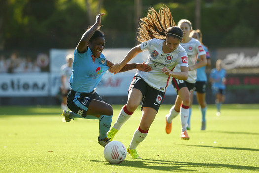 Sydney FC and Western Sydney Wanderers fight for possession