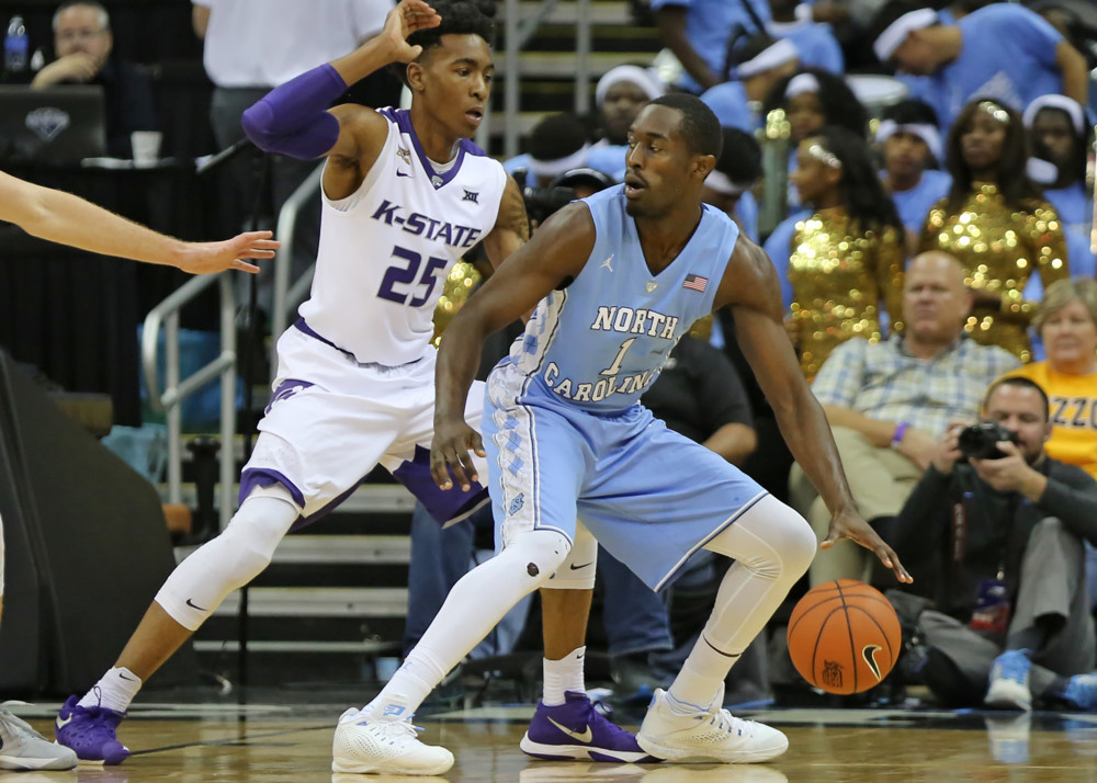 24 November 2015 Kansas State Wildcats forward Wesley Iwundu defends North Carolina Tar Heels forward Theo Pinson in the championship game of the CBE Hall of Fame Classic between the Kansas State Wildcats and the North Carolina Tar Heels at Spri