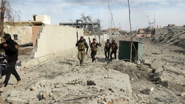 Iraqi Security forces enter the heavy damaged downtown Ramadi 70 miles west of Baghdad Iraq Sunday. | AP