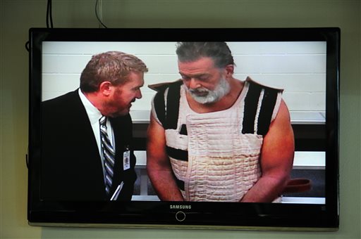 Colorado Springs shooting suspect Robert Dear right appears via video before Judge Gilbert Martinez with public defender Dan King at the El Paso County Criminal Justice Center for this first court appearance where he was told he faces first degree