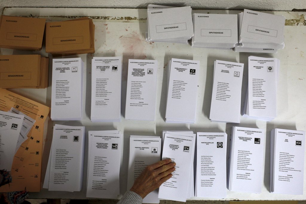 An election worker prepares ballots ahead of Spain's general election at a polling station in Ronda southern Spain yesterday. – Reuters pic