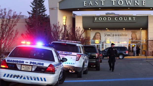 Police officers at the East Towne Mall in Madison Wisconsin after a gun battle between Christmas shoppers