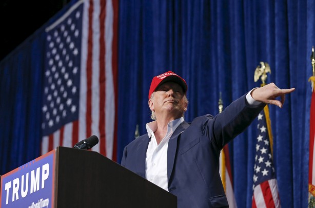 U.S. Republican presidential candidate Donald Trump motions for security to remove a person from his rally in Sarasota Florida