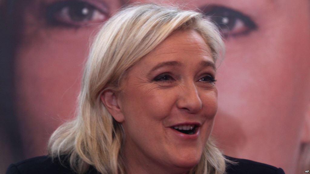 French far-right leader and National Front Party head Marine Le Pen addresses the media during a news conference Monday Dec. 7 2015 in Lille northern France. France's far-right National Front ran strongly in a first-round regional vote