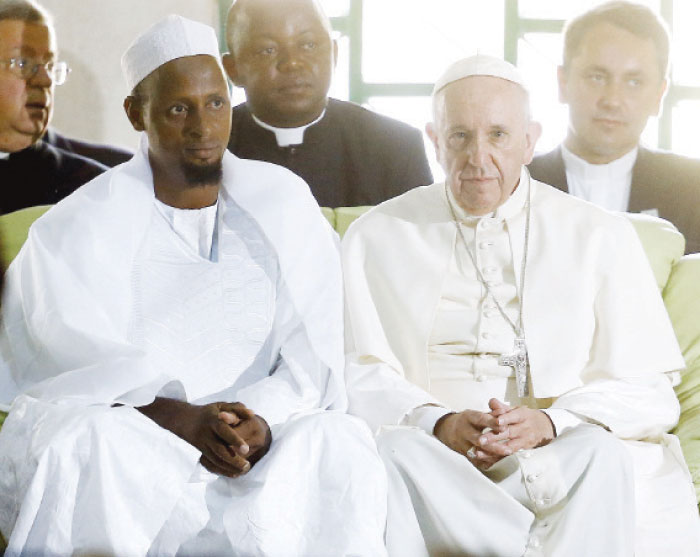 Pope Francis right sits next to Tidiani Moussa Naibi Imam of the Koudoukou Mosque in Bangui Central African Republic on Monday. — Reuters