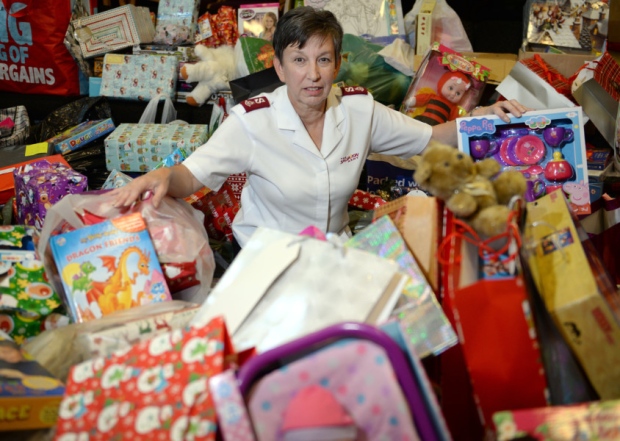 Major Sandra Fisher with the pile of toys the Salvation Army has collected for children in Blackpool