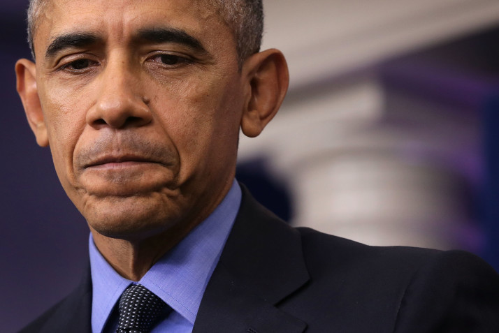 President Barack Obama pauses as he speaks to the media during his year end press conference in the Brady Briefing Room at the White House | Getty