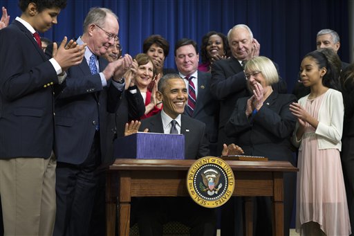 President Barack Obama smiles after signing the'Every Student Succeeds Act' a major education law setting U.S. public schools on a new course of accountability Thursday Dec. 10 2015 in Washington