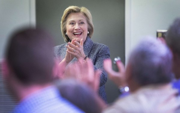 Hillary Clinton speaks to campaign volunteers in Bettendorf Iowa. She plans more multiple-day visits to the first-caucus state during January