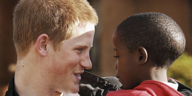 Prince Harry holds his old friend Mutsu Potsane