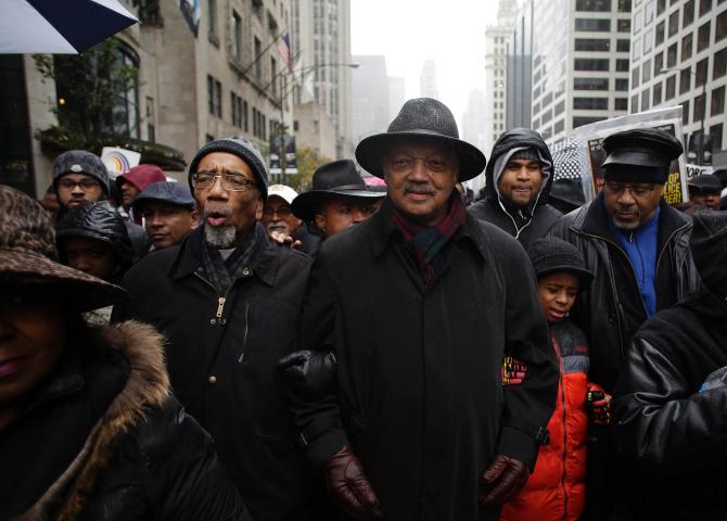 In this Oct. 20 2014 frame from dash-cam video provided by the Chicago Police Department Laquan McDonald right walks down the street moments before being shot by officer Jason Van Dyke in Chicago. Van Dyke who shot Mc Donald 16 times was charged with