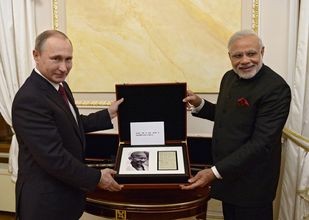 Russian President Vladimir Putin left and Indian Prime Minister Narendra Modi pose for