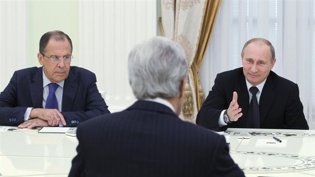 Russia's President Vladimir Putin speaks to US Secretary of State John Kerry as Russia's Foreign Minister Sergei Lavrov listens during their meeting in Moscow