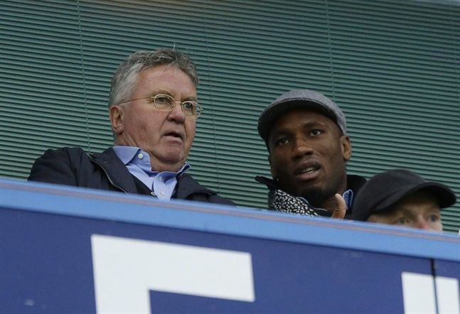 Chelsea's new manager Guus Hiddink left sits next to former Chelsea player Didier Drogba before the English Premier League soccer match between Chelsea and Sunderland at Stamford Bridge stadium in London Saturday Dec. 19 2015. The Montreal Impact are