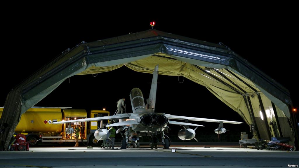 RAF personnel work on a British Tornado after it returned from a mission at RAF Akrotiri in southern Cyprus