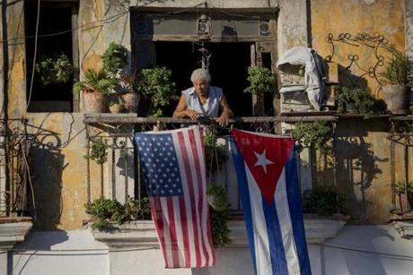 Javier Yanez stood on his balcony decorated with U.S. and Cuban flags in Old Havana Cuba