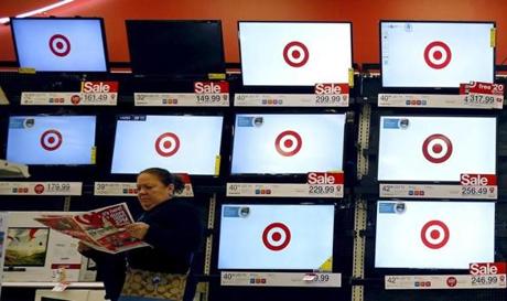 A shopper looks at a sales flier during Black Friday Shopping at a Target store in Chicago Illinois United States November 27, 2015. REUTERS  Jim Young