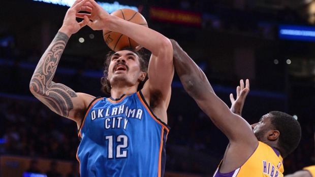 Steven Adams has his shot blocked by Lakers centre Roy Hibbert