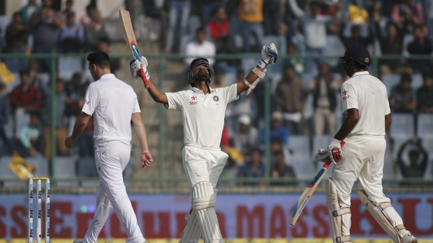 India's Ajinkya Rahane raises his bat and looks heavenwards after reaching three figures against South Africa on Friday. It was the first century by a batsman from either side in the four Test series to date