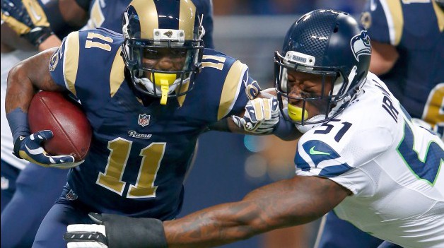 ST. LOUIS MO SEPTEMBER 13 Tavon Austin #11 of the St. Louis Rams rushes against the Seattle Seahawks in the first quarter at the Edward Jones Dome