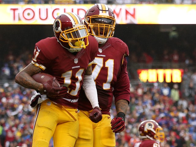 Wide receiver De Sean Jackson #11 of the Washington Redskins celebrates with tackle Trent Williams #71 after scoring a second quarter touchdown against the New York Giants at FedExField