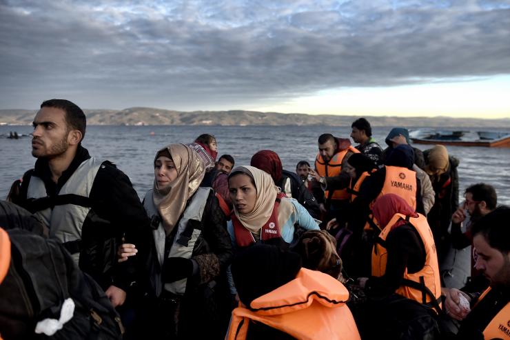 Refugees and migrants arrive at the Greek island of Lesbos after crossing the Aegean sea from Turkey on Dec. 4 2015.                    Getty Images  Aris Messinis  AFP