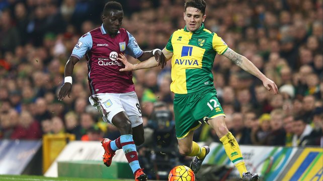 Republic of Ireland international Robbie Brady of Norwich City and Idrissa Gueye of Aston Villa compete for possession