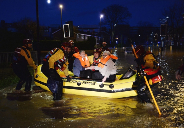 Residents in York are evacuated by members of a Mountain Rescue team after the River Foss bursts its banks