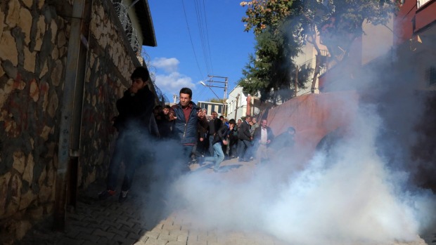 Riot police use teargas to push back pro Kurdish politicians as security forces clash with Kurdistan Workers Party or PKK