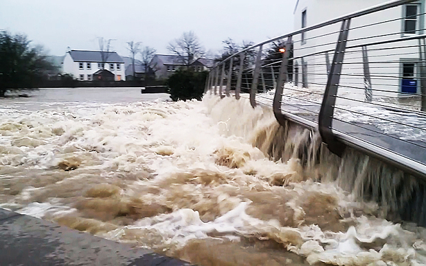 Rising waters at the River Cocker in Cockermouth Cumbria