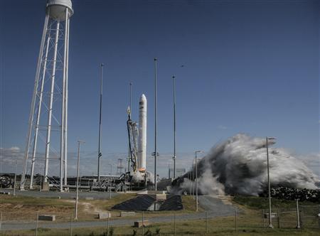 The Orbital Sciences Corporation Antares rocket with the Cygnus cargo spacecraft aboard launches from NASA's Wallops Flight Facility in Virginia