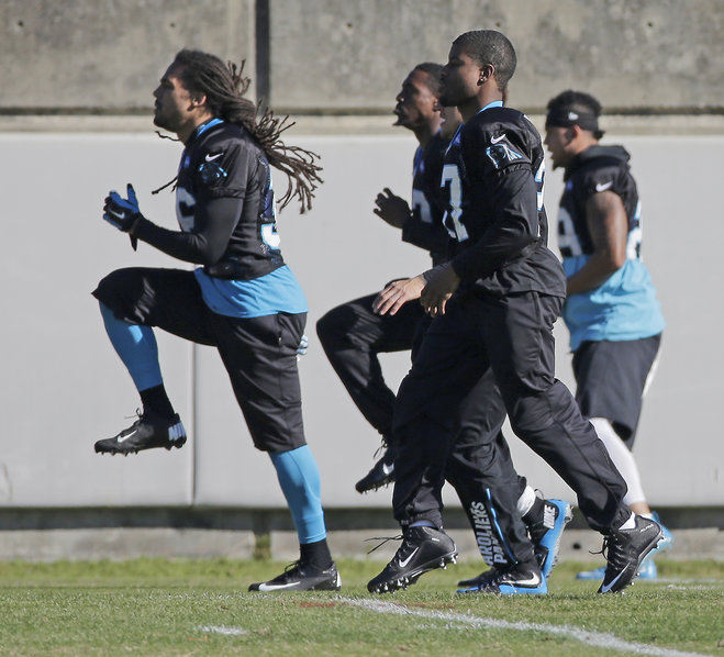 Carolina Panthers players including Robert McClain front and Tre Boston left stretch during practice for the NFL football team in Charlotte N.C. Wednesday Dec. 16 2015