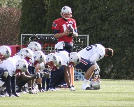 Sports_Patriots New England Patriots quarterback Tom Brady chats with offensive lineman Sebastian Vollmer during Patriots practice in Foxborough Mass. on Friday Nov. 27 2015