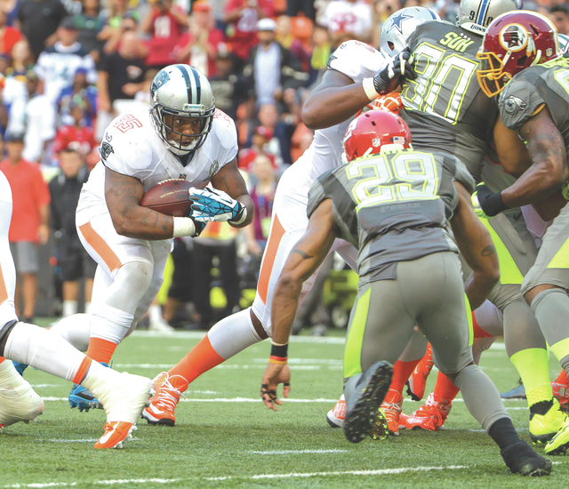 ASSOCIATED PRESS Carolina Panthers fullback Mike Tolbert of Team Rice managed to push his way into the end zone for a 2-point conversion to put Team rice ahead 22-21 over Team Sanders late in the fourth quarter of the 2015 NFL Pro Bowl football game